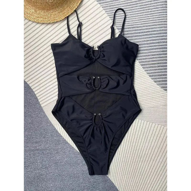 Black women's one-piece swimsuit with solid colour design for swimming activities