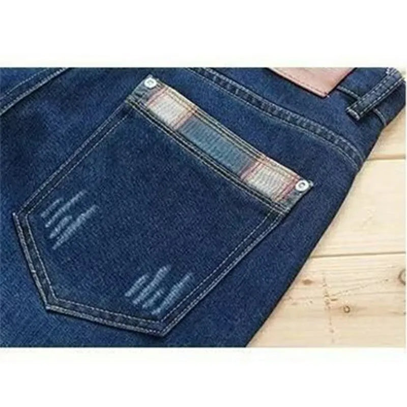 Men's dark blue slim-fit stretch skinny denim pants with zipper fly, side view