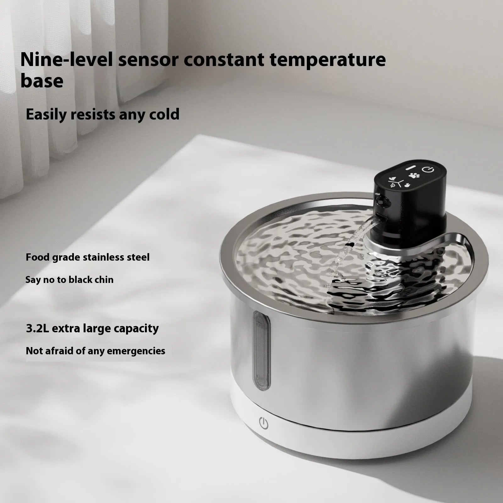 White stainless steel heated pet water fountain with a constant temperature base on a wooden floor.