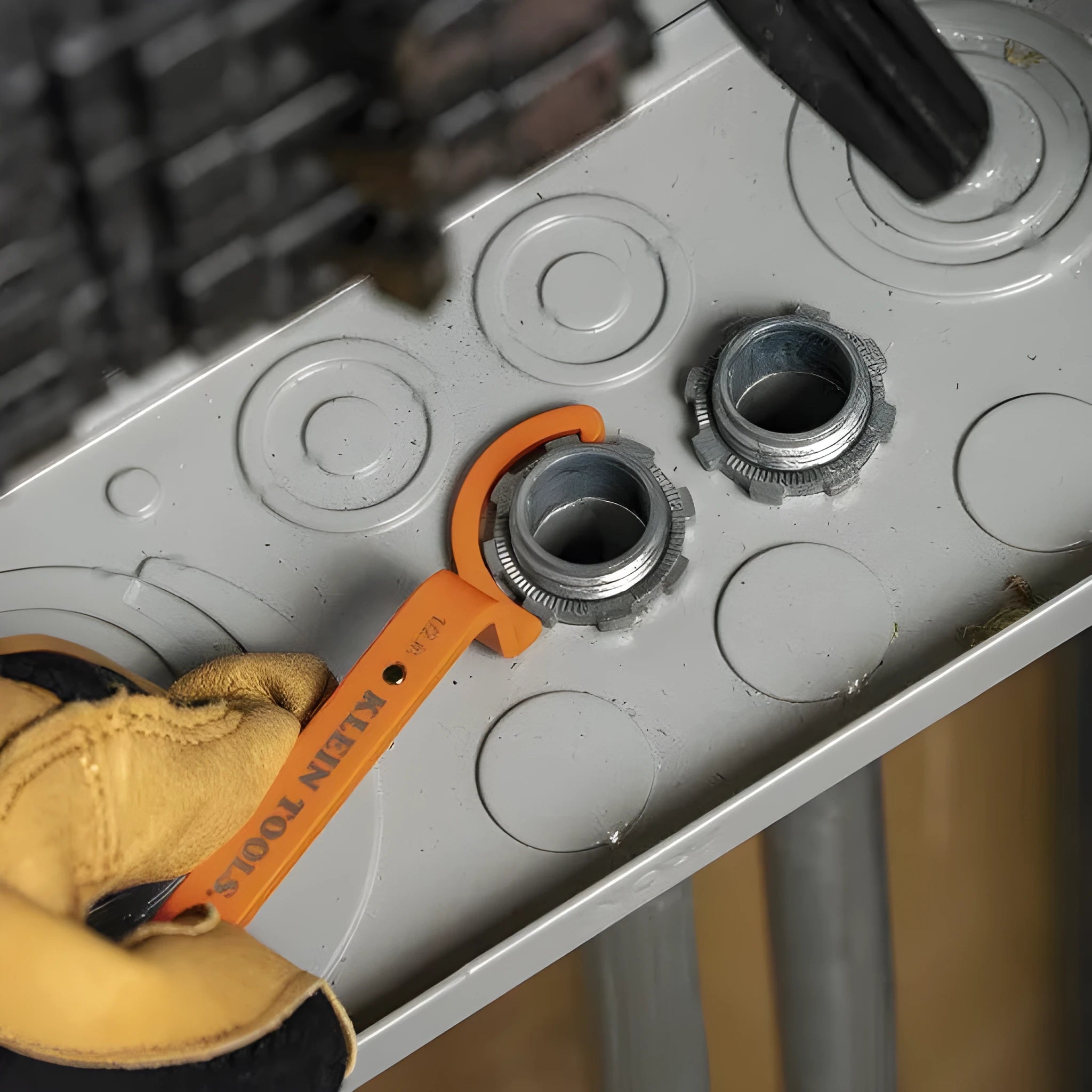 Three magnetic catheter locking wrenches in orange, grey, and black colours displayed together.