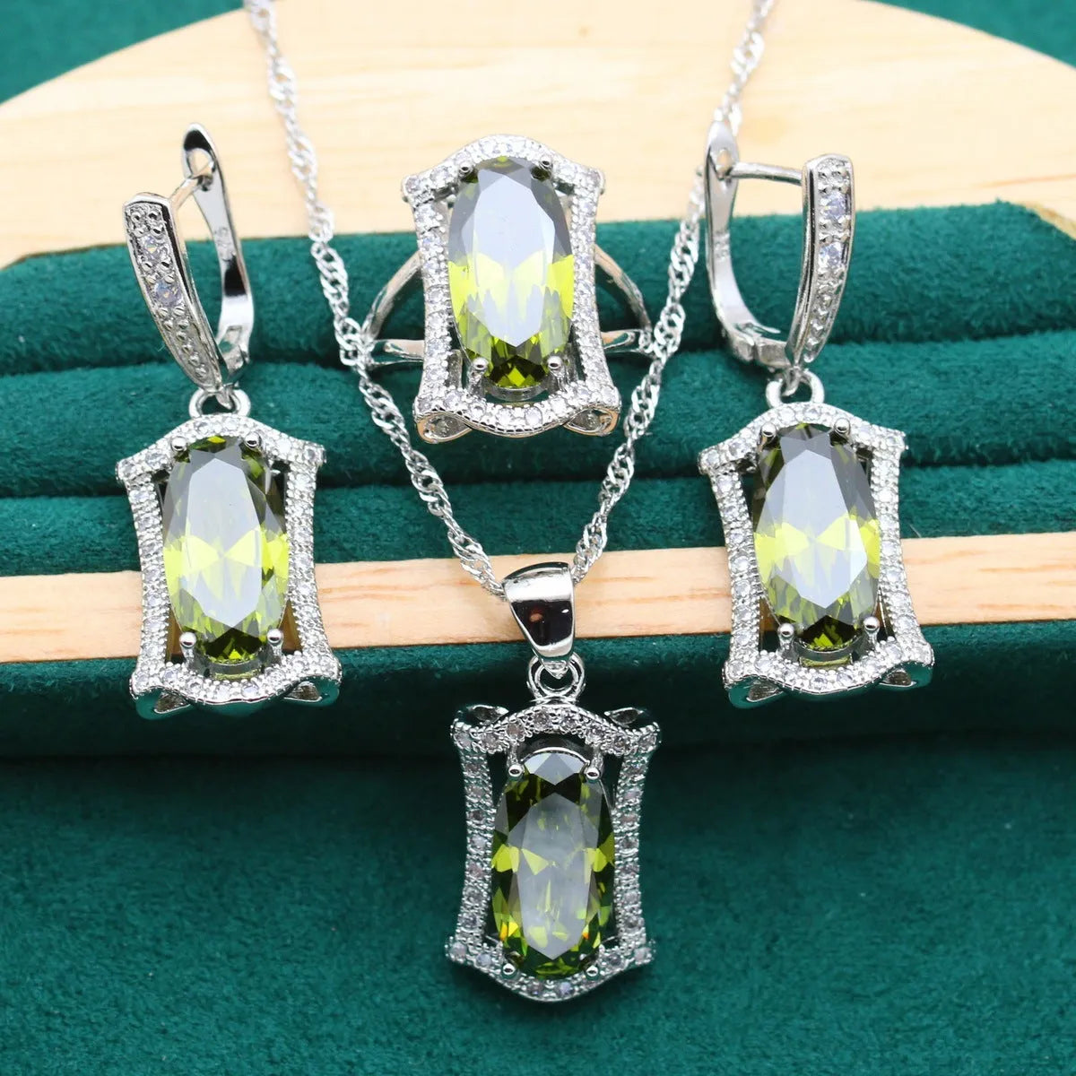 Women's anti-allergy zircon jewellery set with snake bone chain necklace, matching earrings, ring and bracelet in yellow or olive.