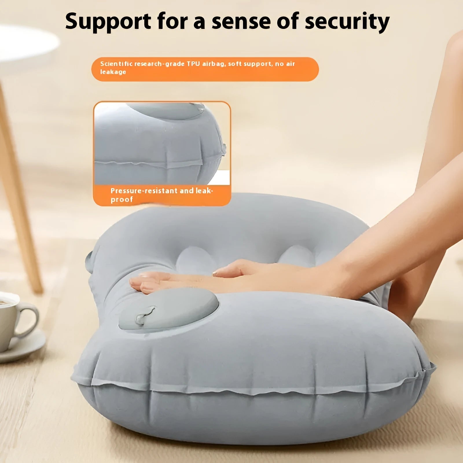 Grey flocking inflatable travel pillow showing compact rectangular shape and textured surface.