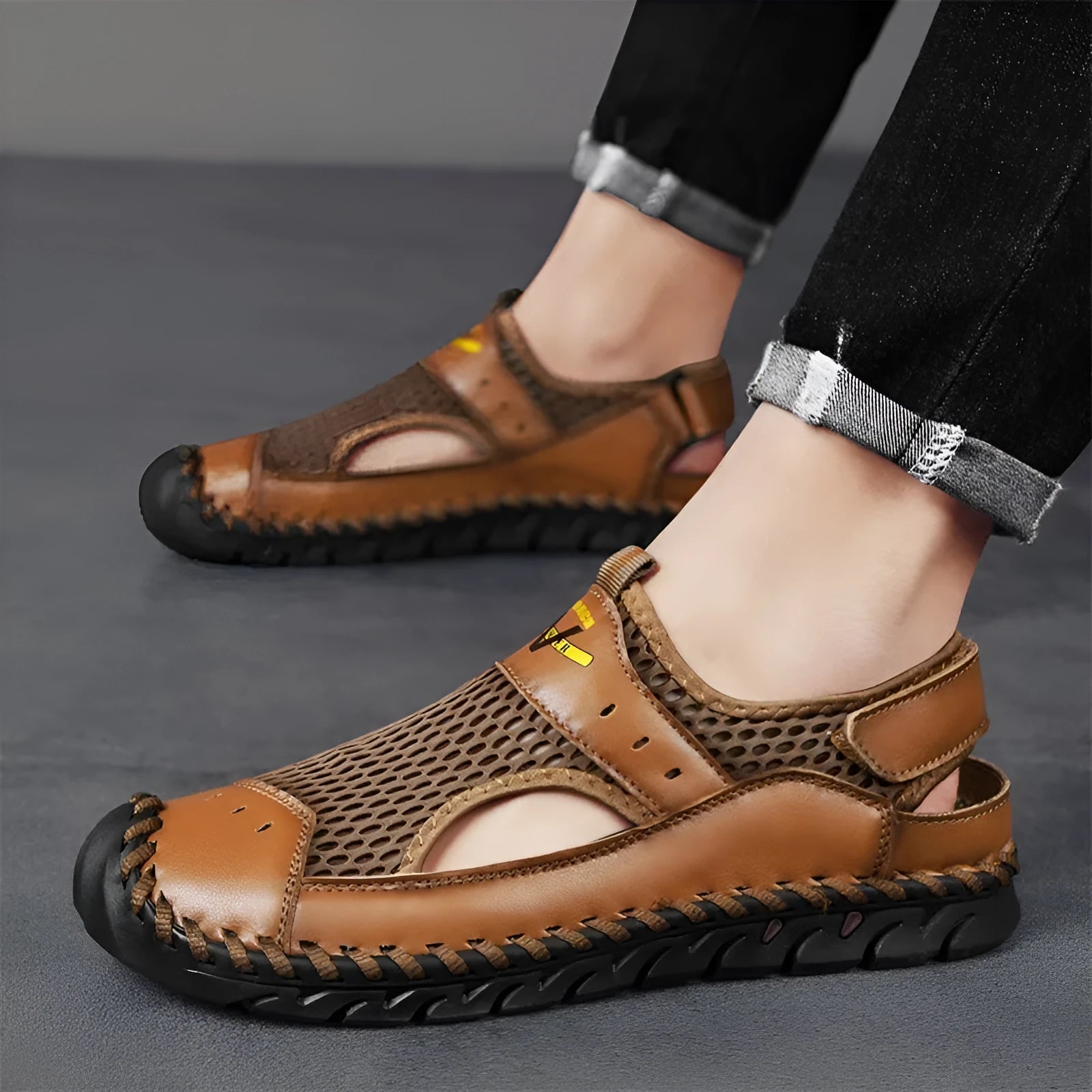 Men's brown genuine leather mesh breathable casual shoes with elastic band and round toe on a white background.