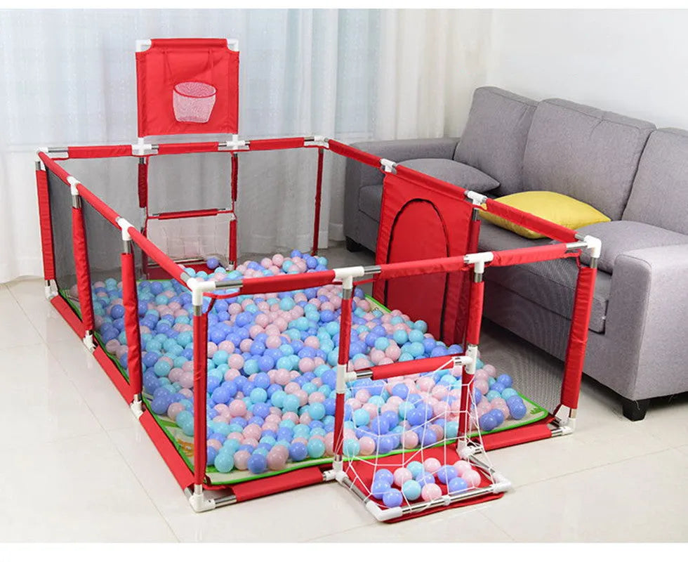 A large dark grey children's playpen tent with a stainless steel frame set up indoors.