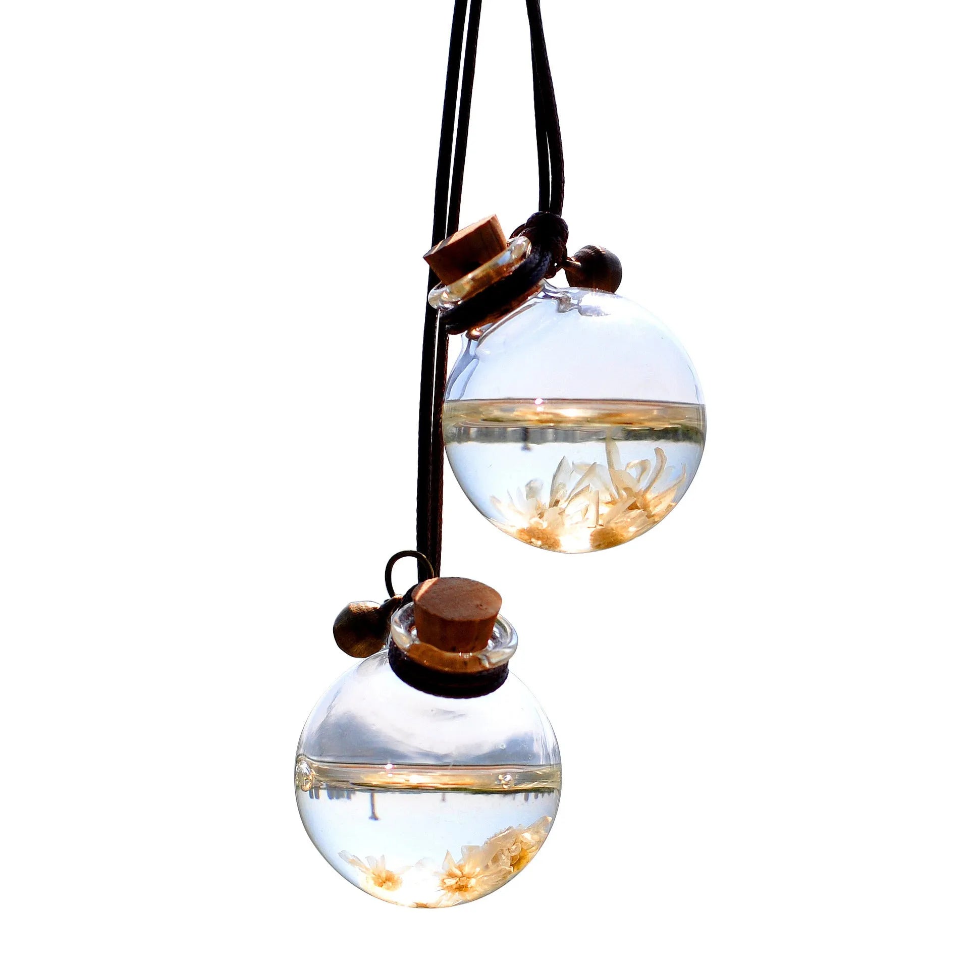 Glass car perfume pendant with preserved flowers inside, shown in light pink hydrangea colour