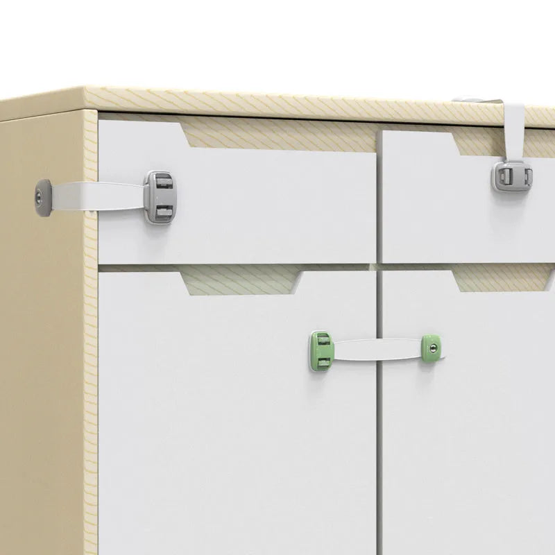 Adjustable grey child safety lock strap installed on a cabinet door