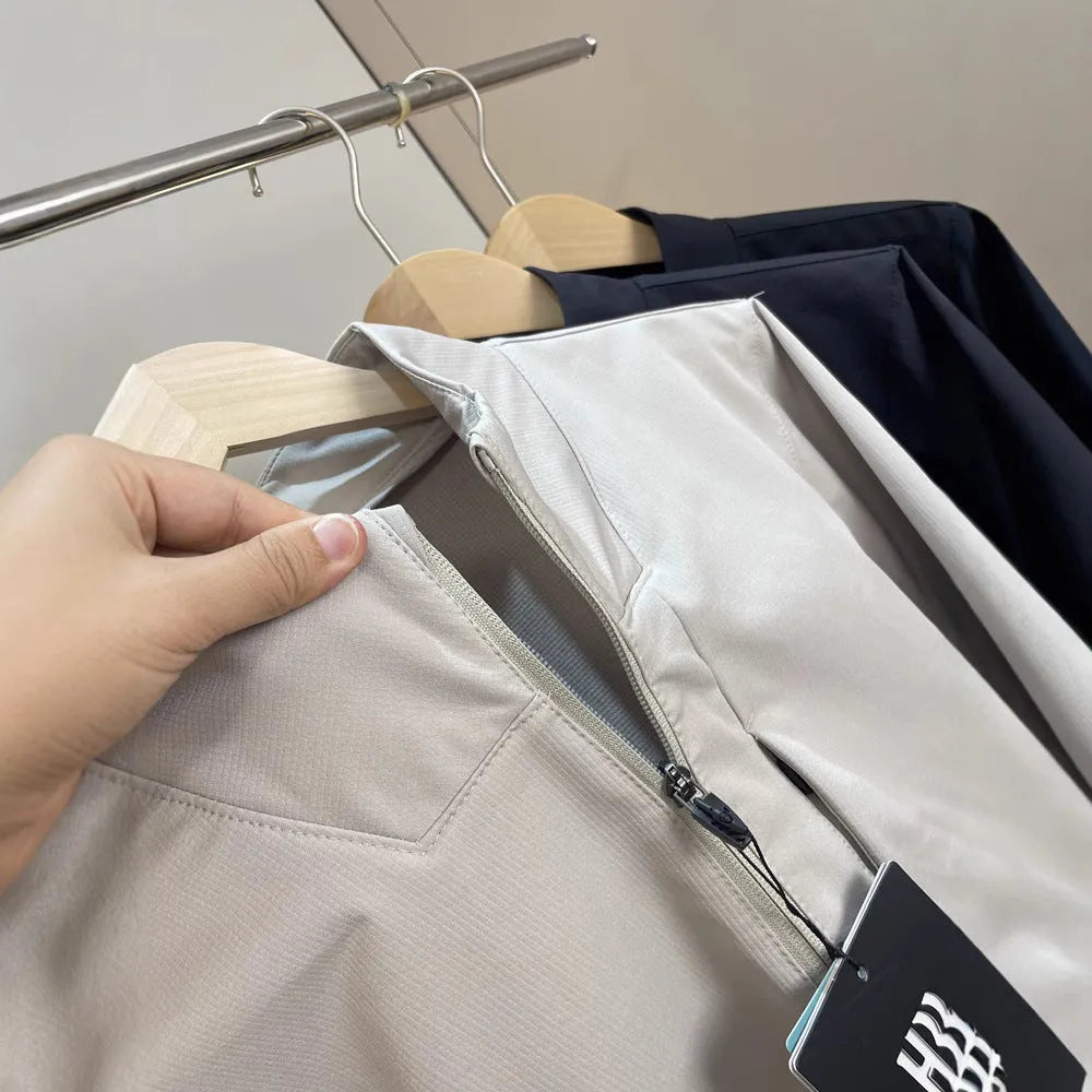 Men's beige stand collar polyester casual jacket with long sleeves and straight hem.