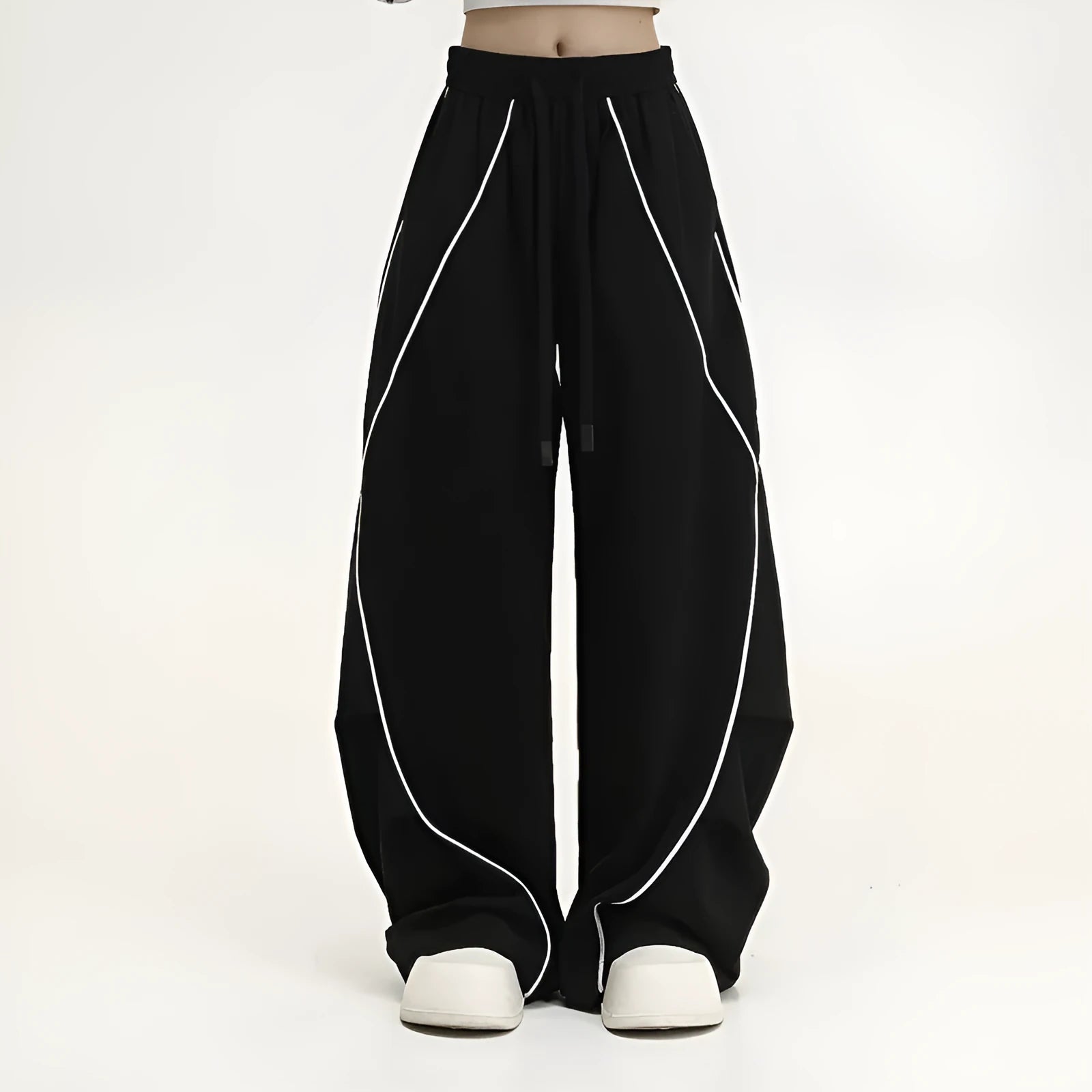 Black pleated wide-leg hip hop trousers with stripe pattern showing loose fit design