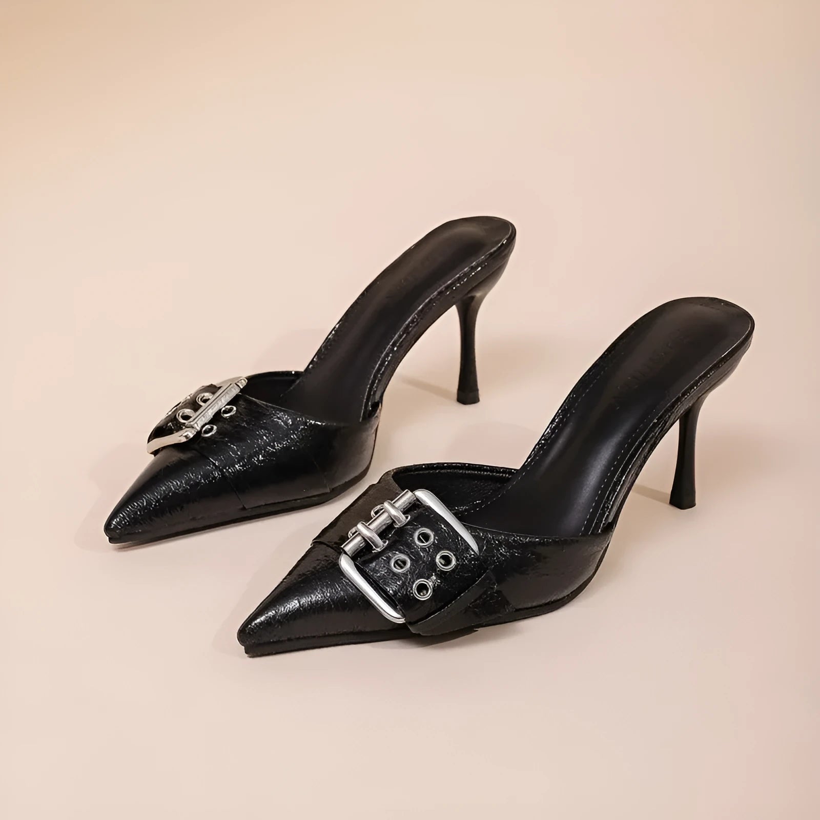 Black women's high heel shoes with pointed toe, ankle strap, and buckle decoration