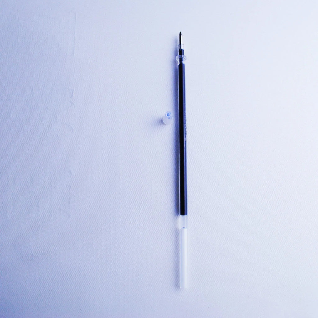 Blue automatic fading pen set with 0.5mm tip, eight refills, and pen holder on white background