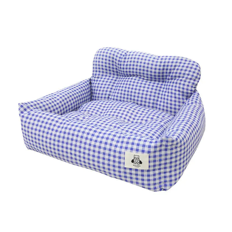 Grey and blue plaid cloth dog car travel nest shown on a car seat, with small and large size options.
