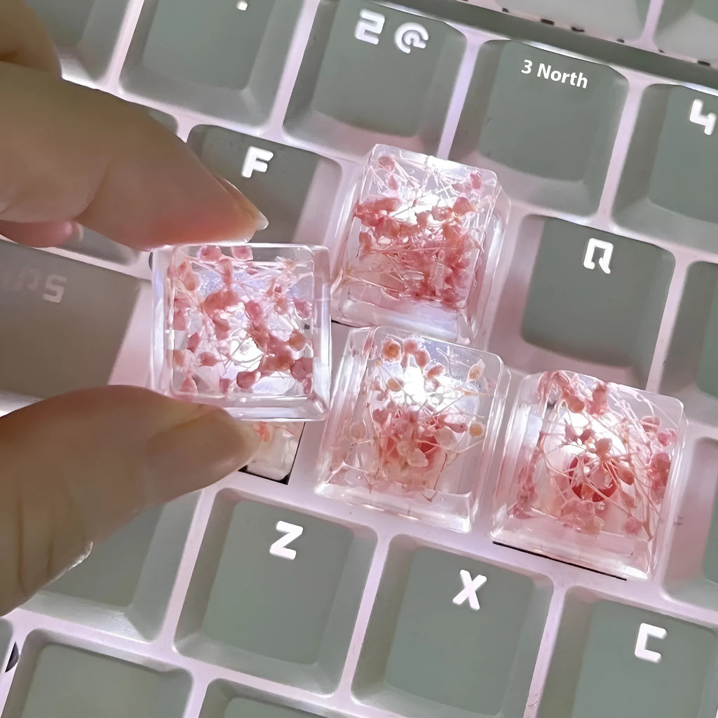 Transparent resin keycap with starry sky design in red, pink, green, or violet colours