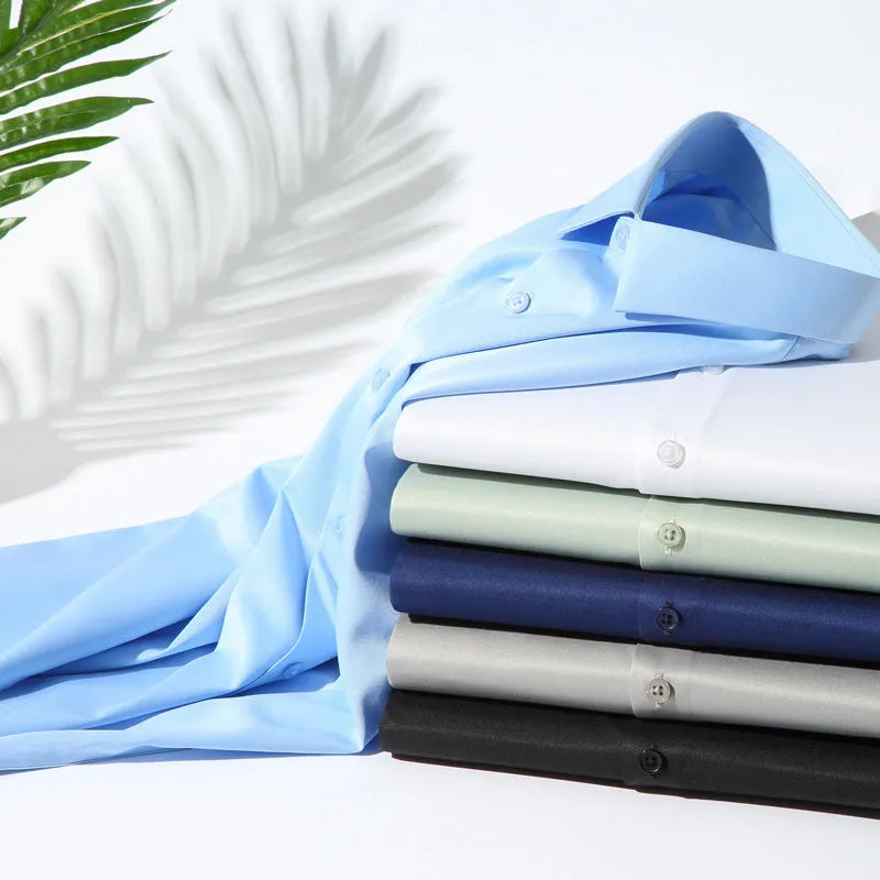 Man wearing a solid colour long-sleeved non-ironing shirt made from elastic polyester spandex fabric.