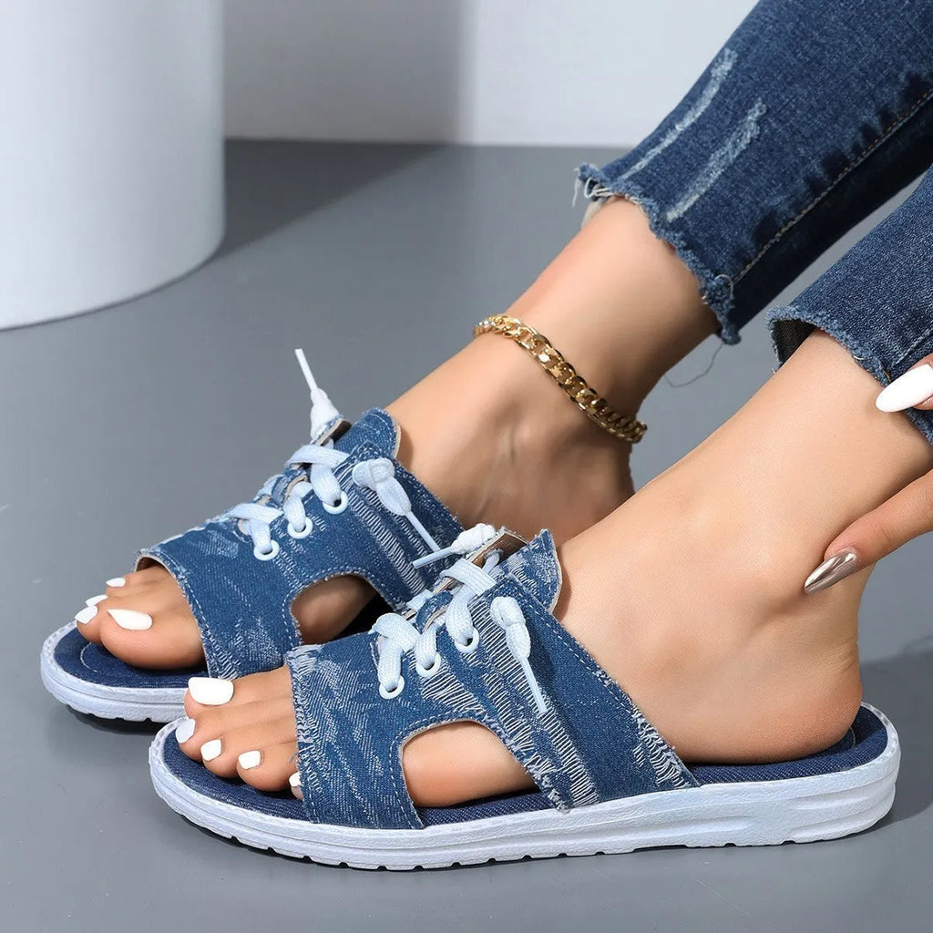 Blue Roman-style women's canvas slippers with flat design and rubber sole