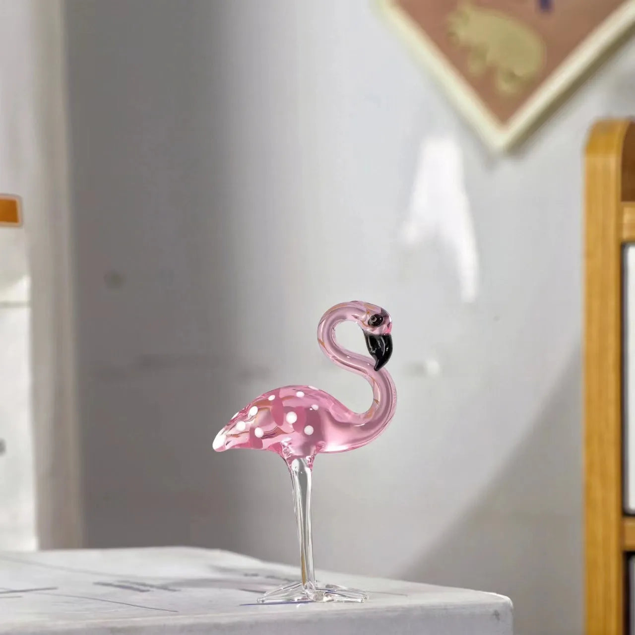 Pink crystal flamingo decorative ornament on table with modern simple design