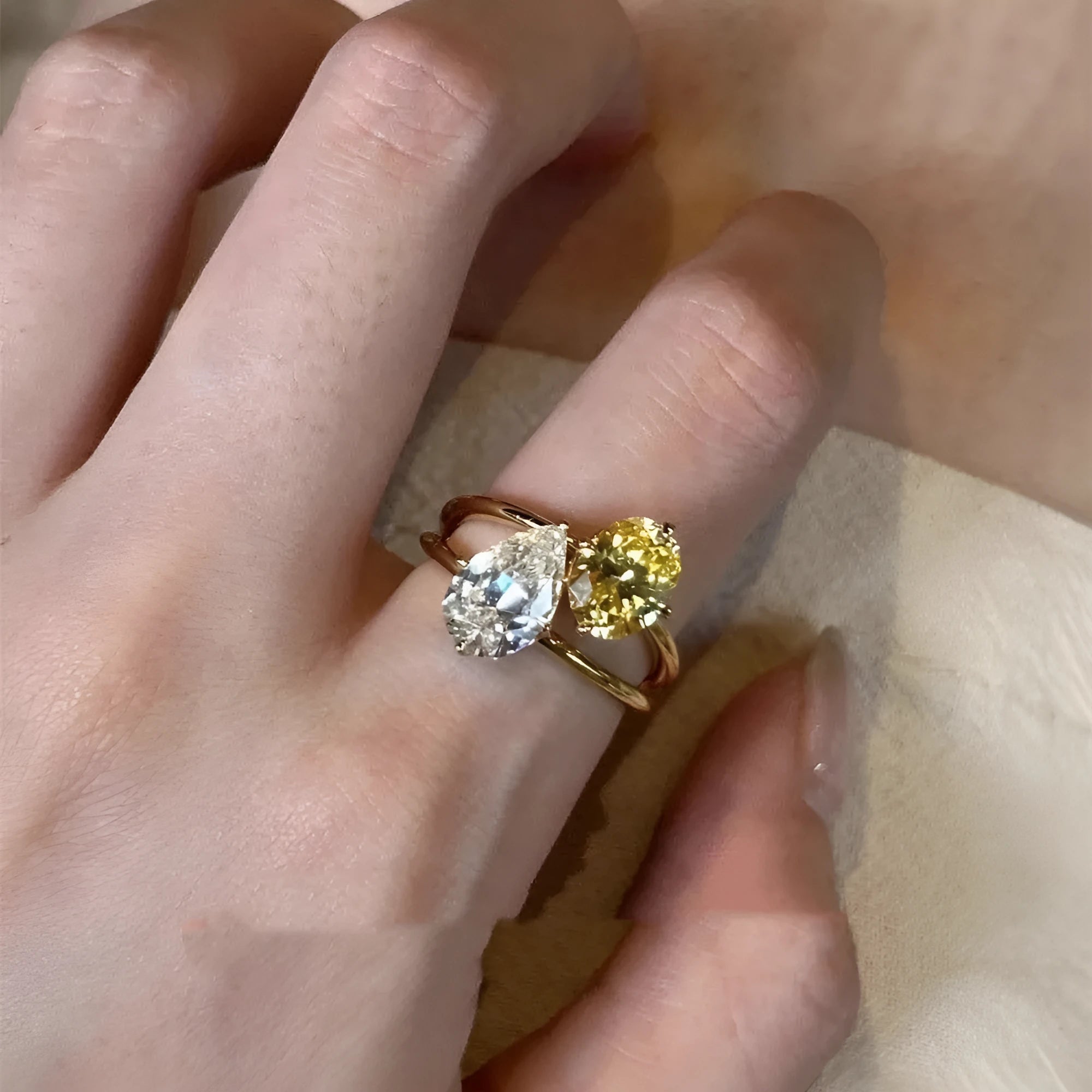 Copper geometric open ring for women with a water drop double sheng stone in a contrast colour.