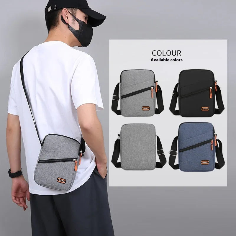 Solid colour Oxford cloth commuter bag with contrast detailing and crossbody shoulder strap