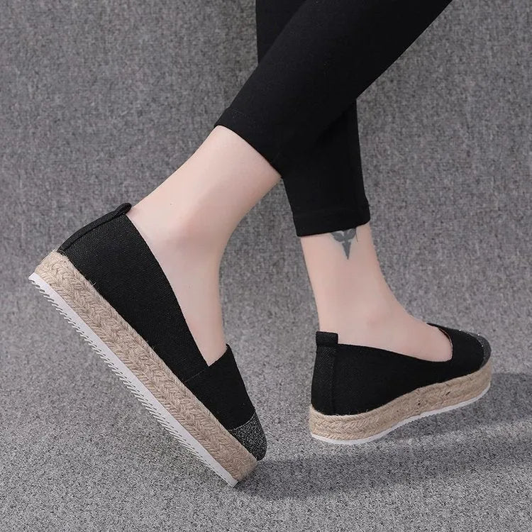 Plus size canvas oversleeve shoes in black and beige colours showing round toe design
