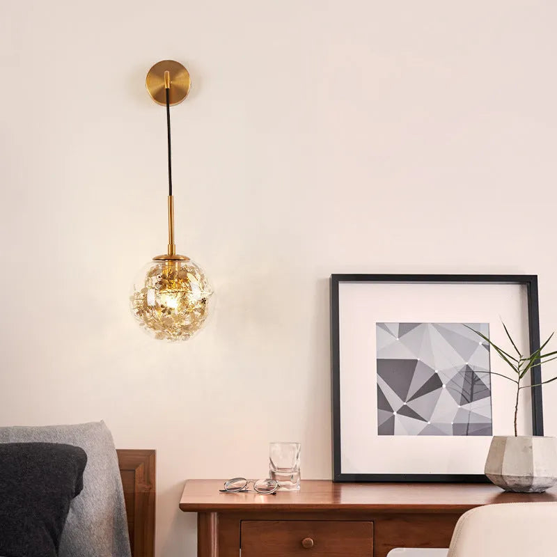 Modern glass wall lamp in golden flower finish with LED bedside lighting