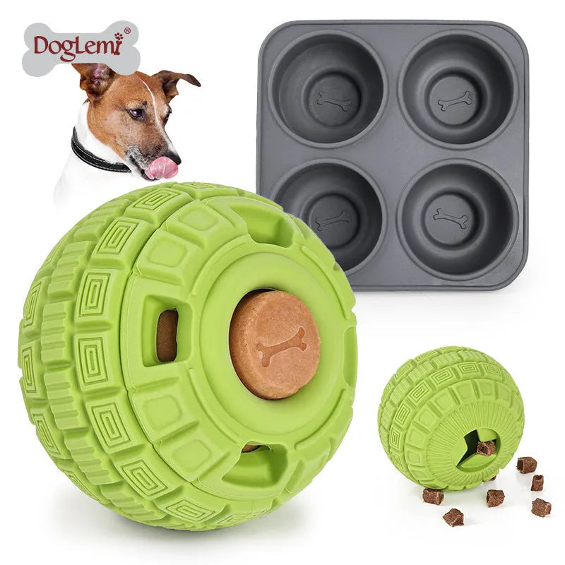 Green and orange natural rubber hollow ball dog toy for slow feeding and chewing.