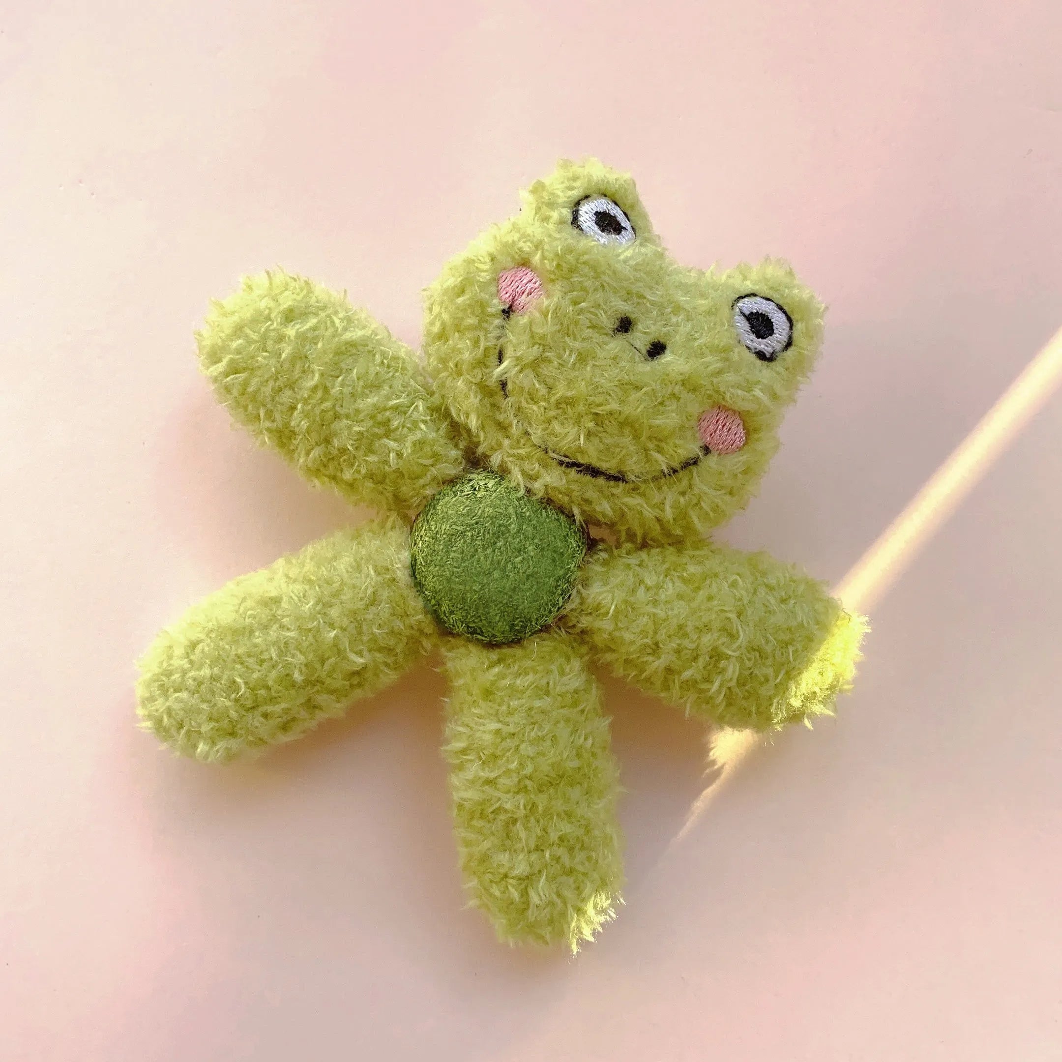 Interactive catnip ball toy with edible catnip stuffing for kitten dental care in character designs