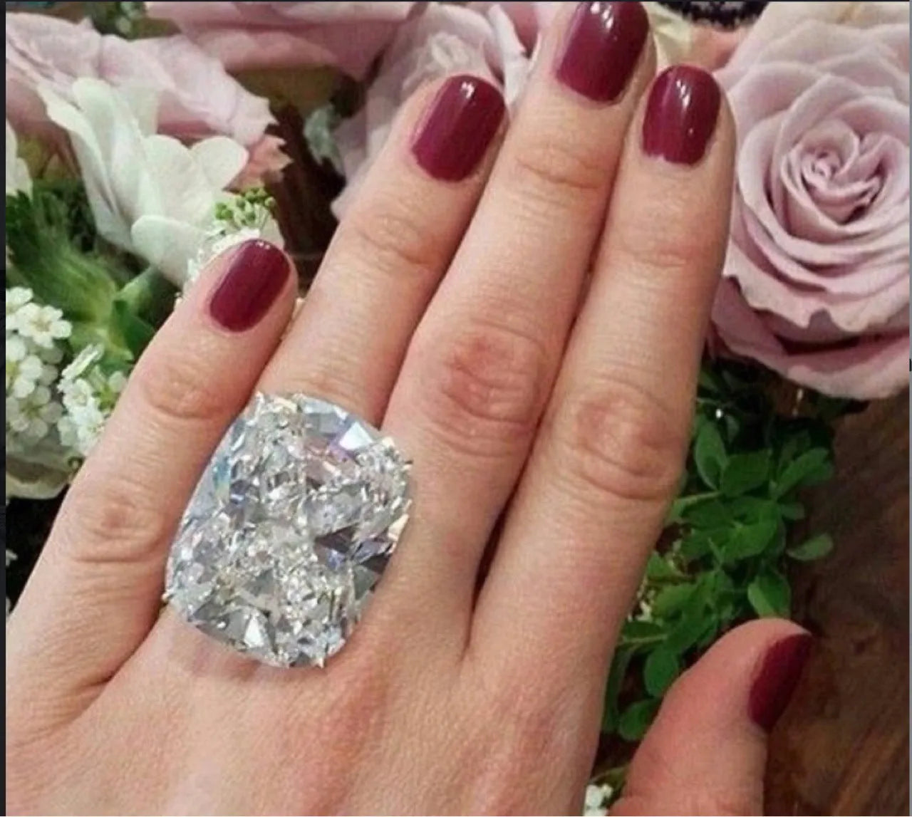 Simple white gold-coloured alloy ring with an inlaid square diamond geometric design.