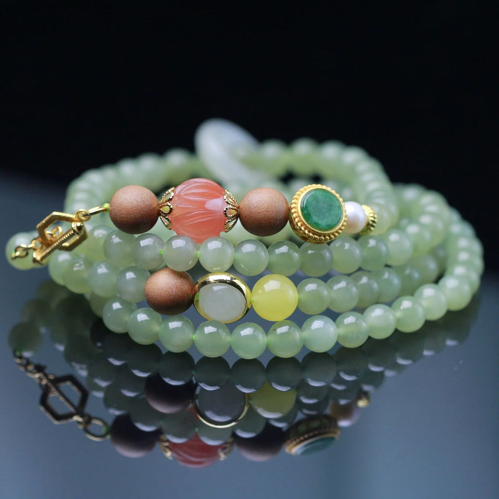 Hetian jade lotus bead necklace and bracelet set with white sandalwood and beeswax accents.