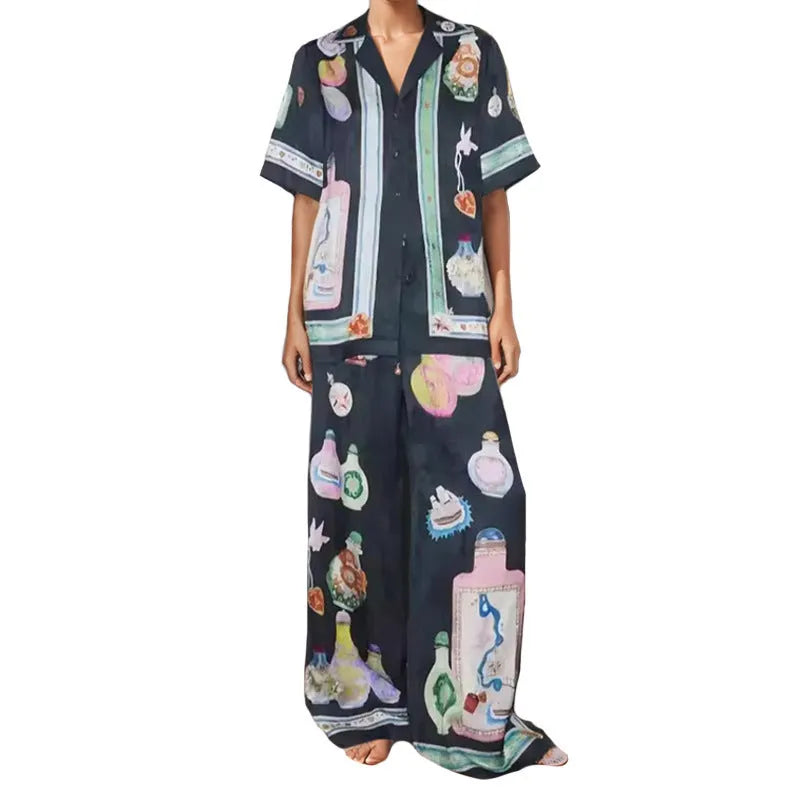 Black women's two-piece cardigan and trousers set with a cartoon animation pattern print.