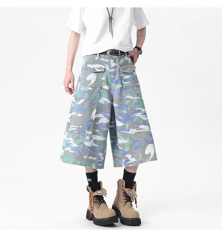 Camouflage pattern cotton cropped cargo trousers on a hanger, showing straight leg and pocket detail.