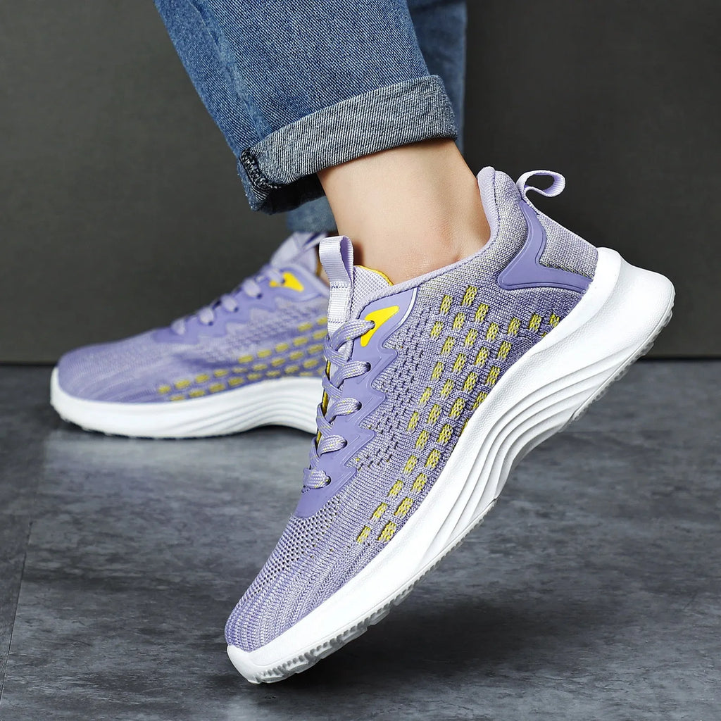 Women's lavender purple running shoes with mesh upper and EVA sole for sports.