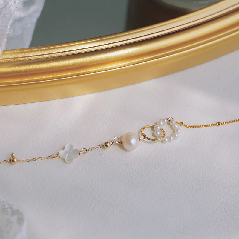 A natural pearl set in a gold-plated bracelet for women.