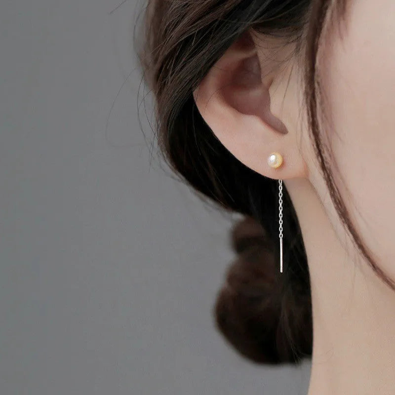 Sterling silver needle ear strings with hanging pearl and geometric designs for female wearers