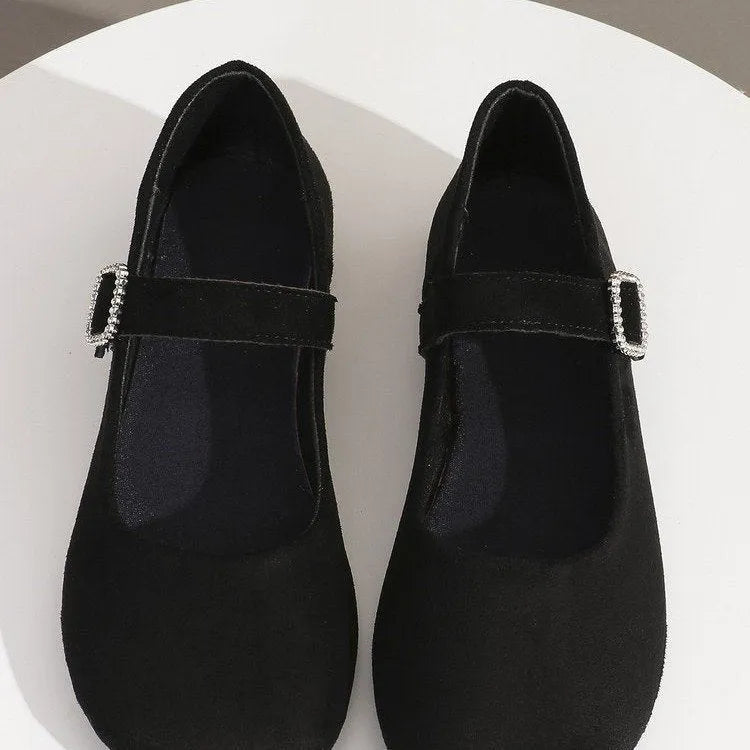 Black canvas men's fisherman shoes with a flat rubber sole, shown from the side.