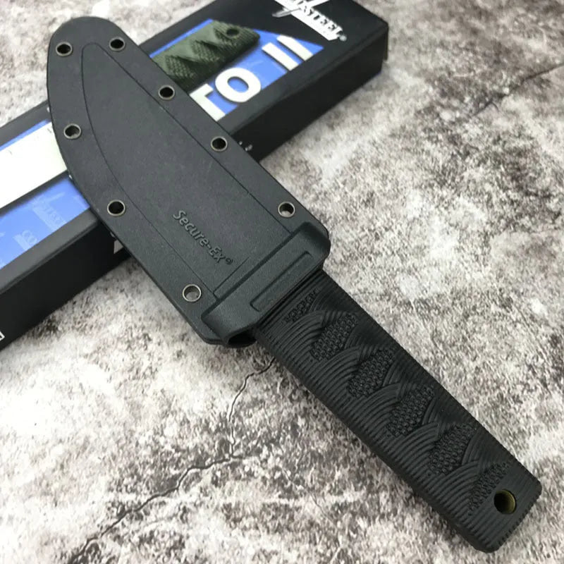 Mini fixed blade knife with 440C steel blade and ABS handle on a wooden surface