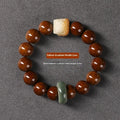 Hand-woven 13mm round bead bracelet in ivory nut lion style with single circle design