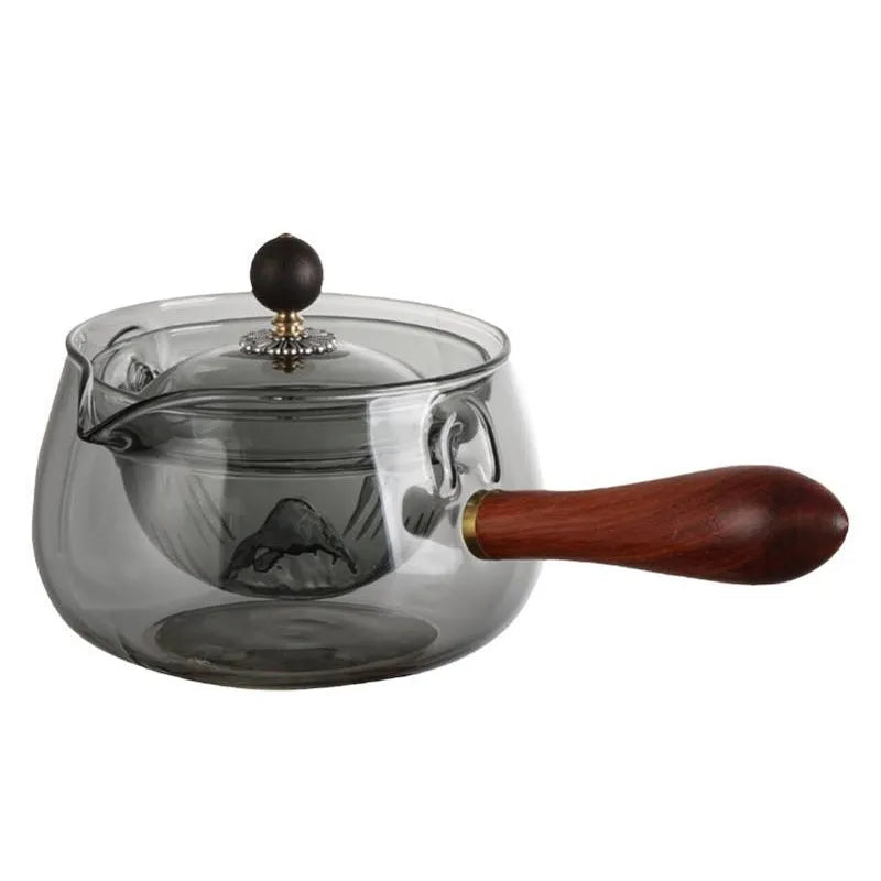 Transparent borosilicate glass teapot with wooden handle and rotation mechanism