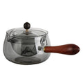 Transparent borosilicate glass teapot with wooden handle and rotation mechanism