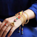 Brazilian citrine bracelet with red and yellow colours on adjustable filament cord