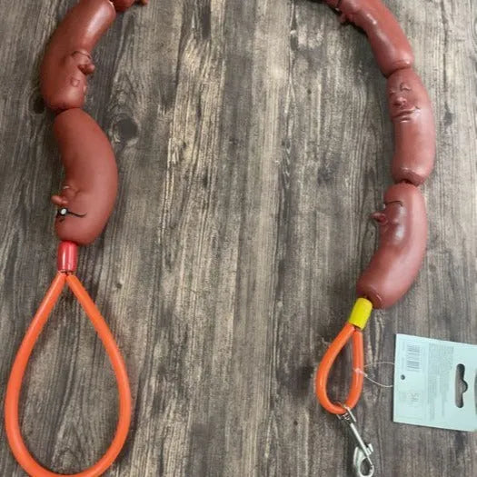 Brown sausage-link dog hand rope toy with grip tape, total length 108cm.