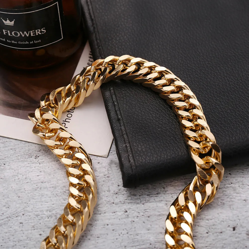 Gold tone thick chain women's necklace on a white background, showing the clasp and extender.
