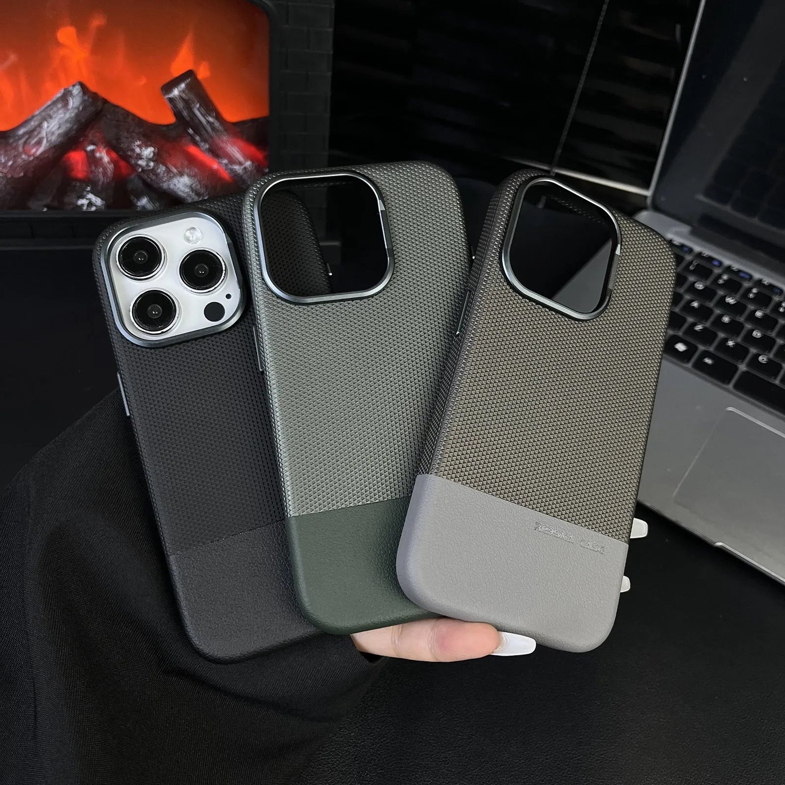 Black magnetic iPhone case with dragon scale texture and stitching, shown on an iPhone 15 Pro.