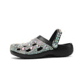 Black women's platform sandals with rhinestone decoration and a perforated slider design.