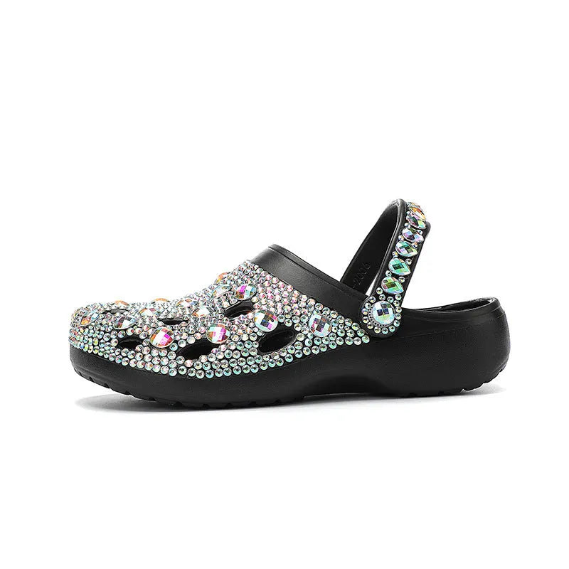 Black women's platform sandals with rhinestone decoration and a perforated slider design.