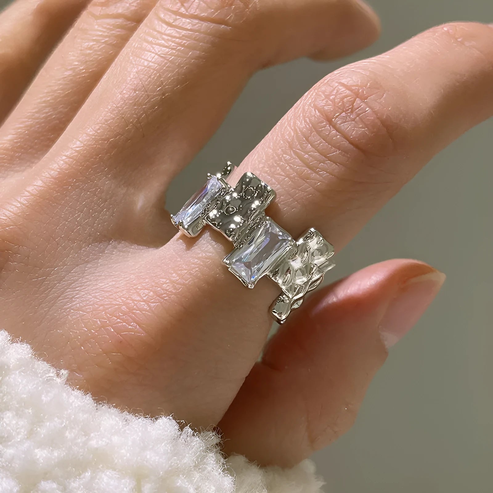Silver geometric open ring with cross design and zircon centrepiece