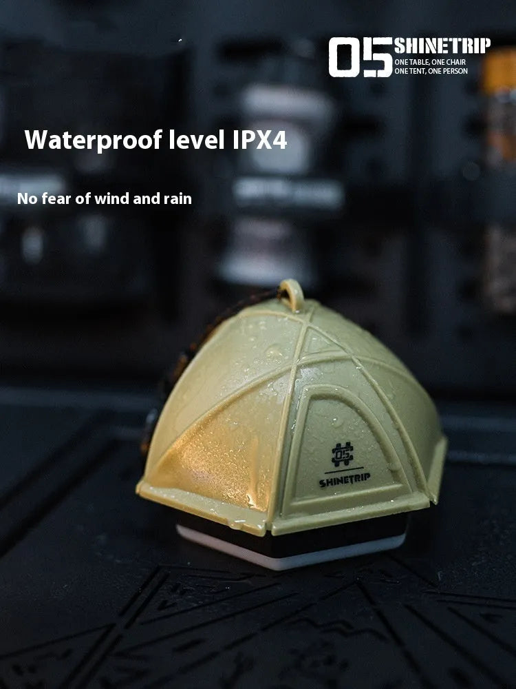 Dark green camping tent light with analog brightness dial, shown at 10.5cm tall.
