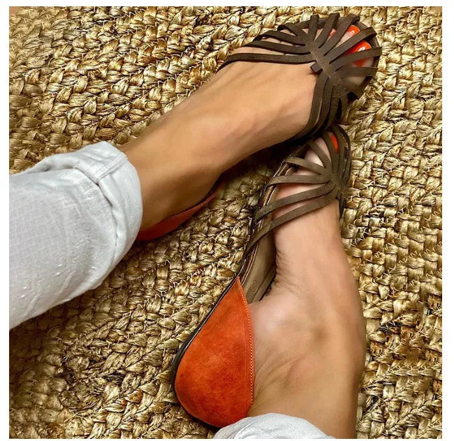 Women's dark brown leopard print flat sandals with a square buckle and ankle strap.
