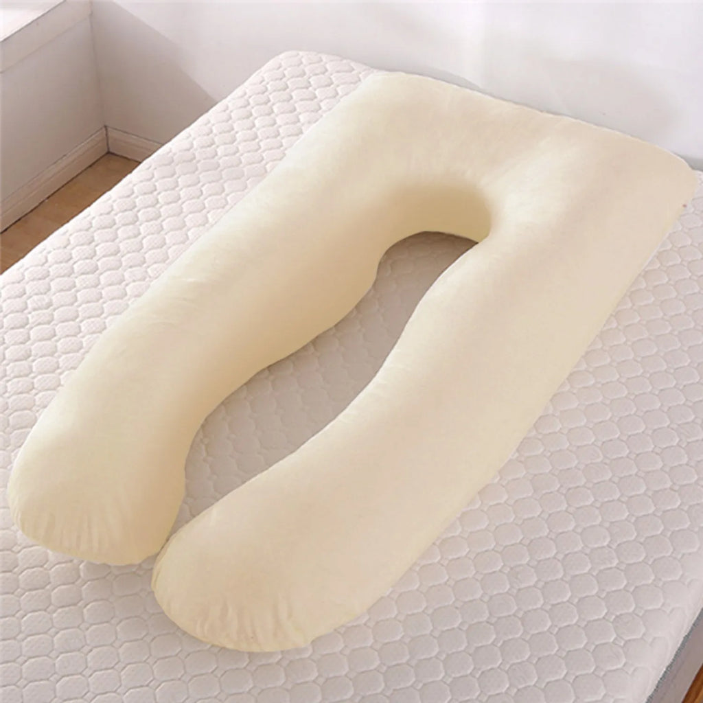 U-shaped pregnancy pillow in light blue ice silk fabric on a bed.