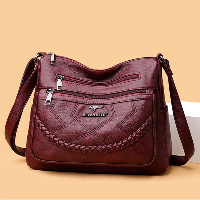 Soft leather women's shoulder bag in horizontal square design with crossbody strap