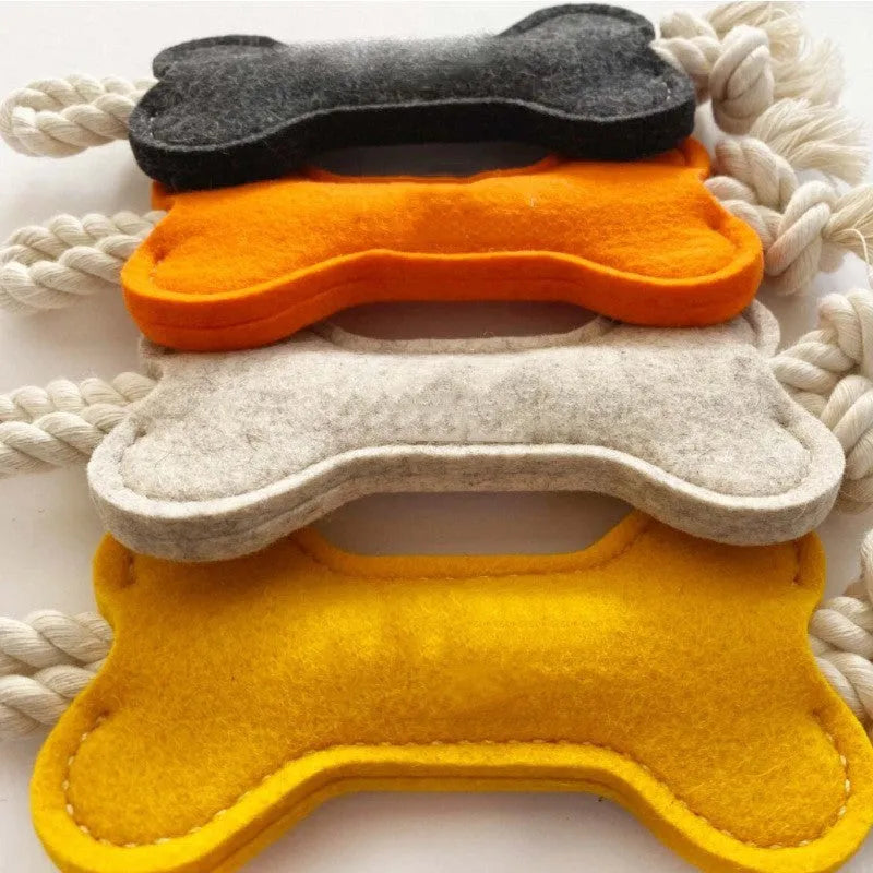Blue bone-shaped dog chew toy made of felt fabric with visible rope knots.