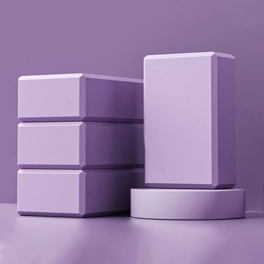 High-density EVA foam yoga block measuring 23x15x7.6cm with twelve grip ridges in solid colour